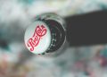 Close-up top view of an open Pepsi Cola glass bottle showcasing its iconic branding.